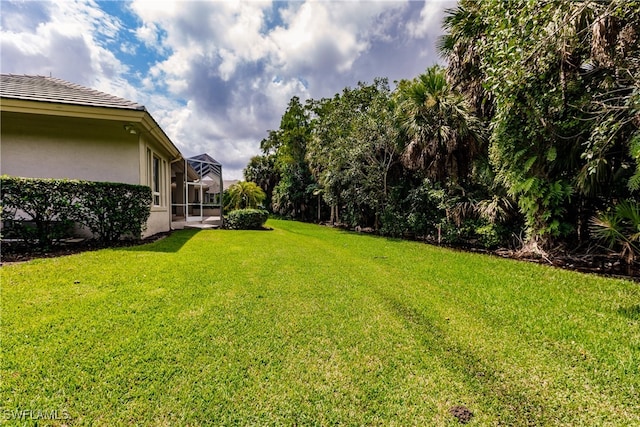 view of yard featuring a lanai