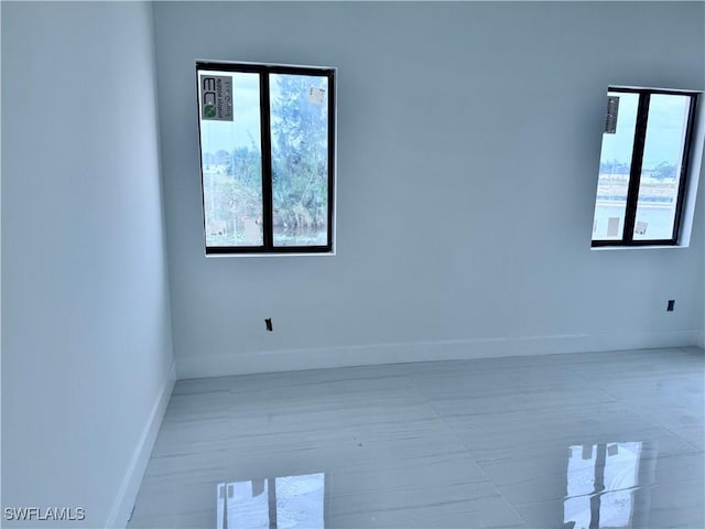 spare room featuring light tile patterned floors