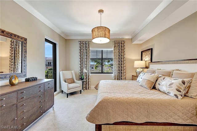 carpeted bedroom with crown molding and access to exterior