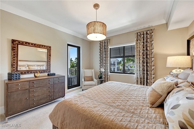 bedroom featuring crown molding, light colored carpet, and access to outside