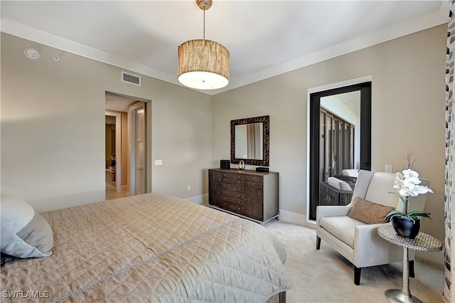 carpeted bedroom featuring crown molding