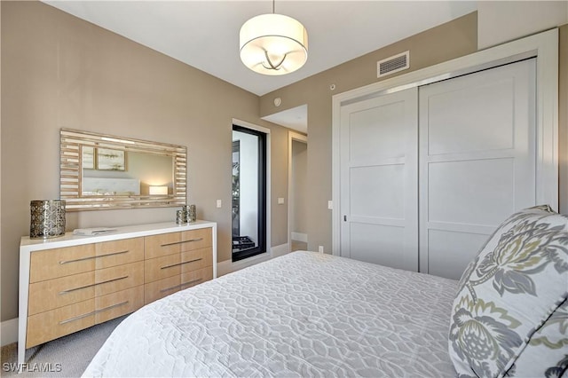 bedroom featuring carpet and a closet