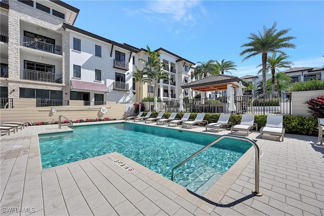 view of swimming pool with a patio and a gazebo