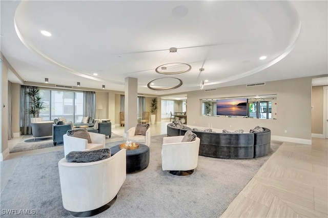 living room with a raised ceiling