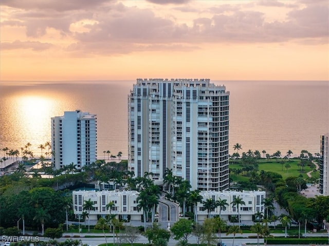 outdoor building at dusk featuring a water view