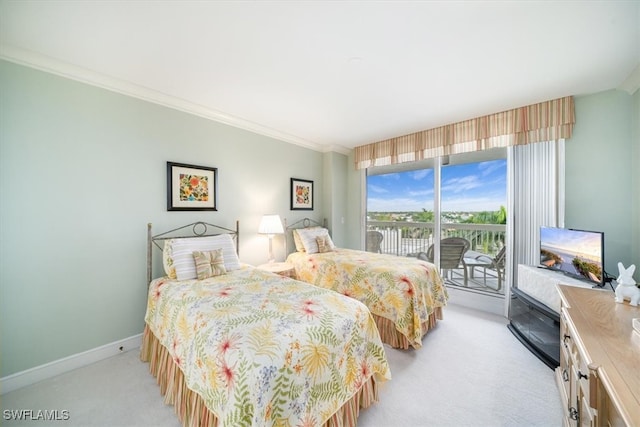 carpeted bedroom featuring crown molding and access to outside