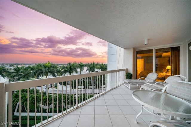 view of balcony at dusk