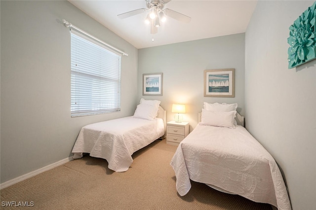 bedroom with ceiling fan and light colored carpet