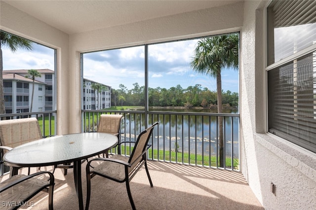 sunroom with a water view