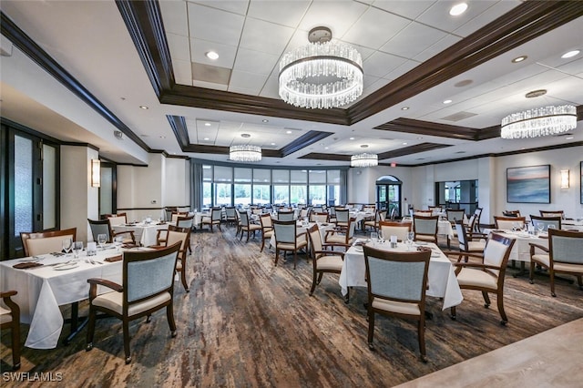 dining area with wood-type flooring, a chandelier, beamed ceiling, coffered ceiling, and crown molding