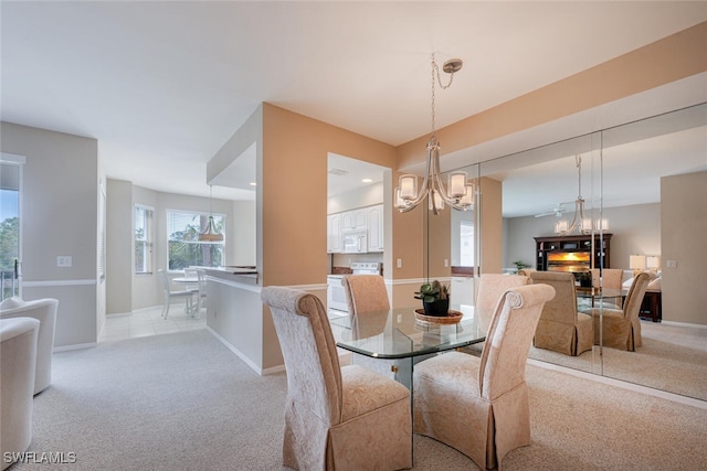 dining room featuring light carpet