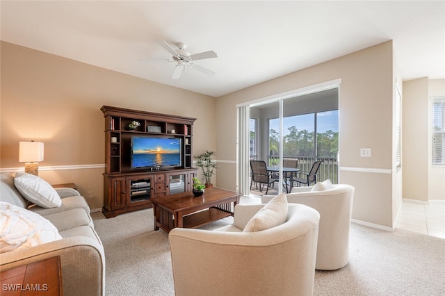 living room with ceiling fan and light colored carpet