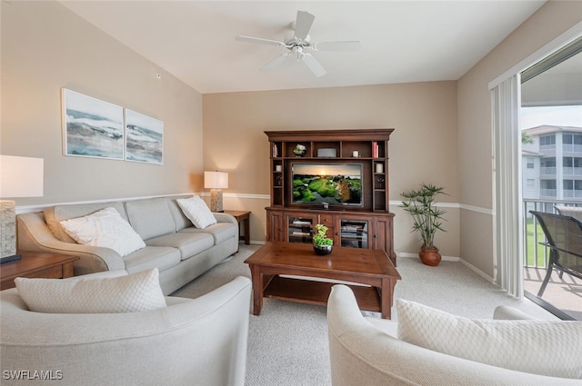 living room featuring ceiling fan and carpet flooring