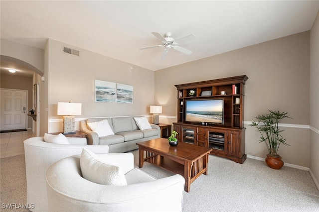 living room featuring ceiling fan and light colored carpet