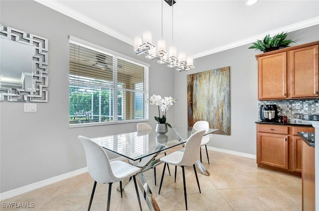 dining space with ornamental molding, light tile patterned flooring, and an inviting chandelier