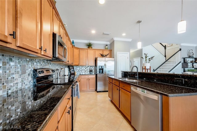 kitchen with ornamental molding, sink, stainless steel appliances, dark stone counters, and decorative backsplash