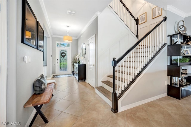 entryway with light tile patterned floors, baseboards, visible vents, stairs, and crown molding