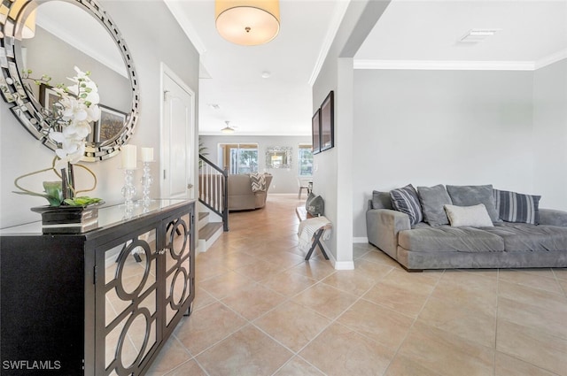 hall with light tile patterned floors, baseboards, visible vents, stairway, and crown molding