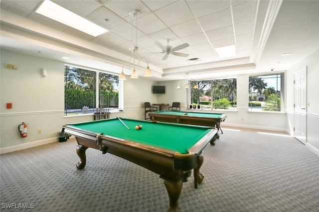 game room with carpet, ceiling fan, and a raised ceiling