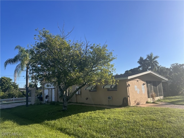 view of home's exterior featuring a lawn