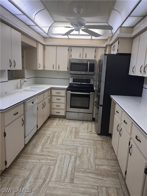 kitchen with stainless steel appliances and white cabinetry