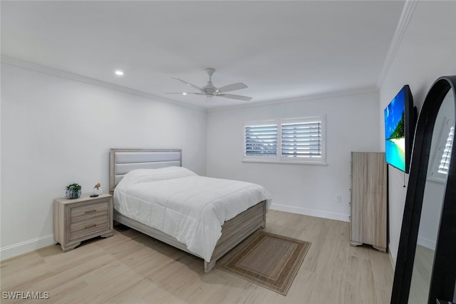 bedroom with ceiling fan, ornamental molding, and light wood-type flooring