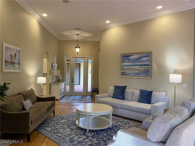 living room featuring light hardwood / wood-style floors and ornamental molding