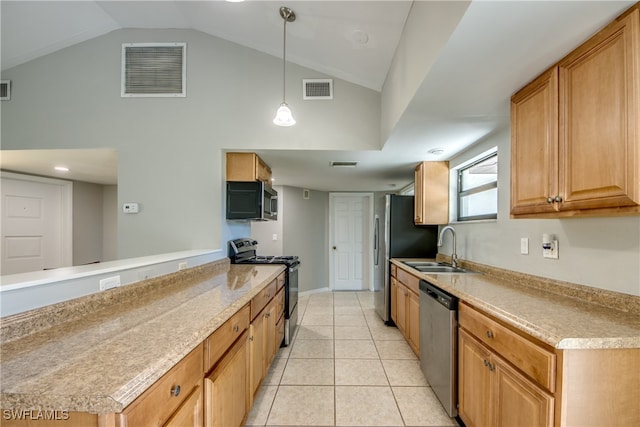 kitchen featuring lofted ceiling, sink, pendant lighting, light tile patterned floors, and stainless steel appliances