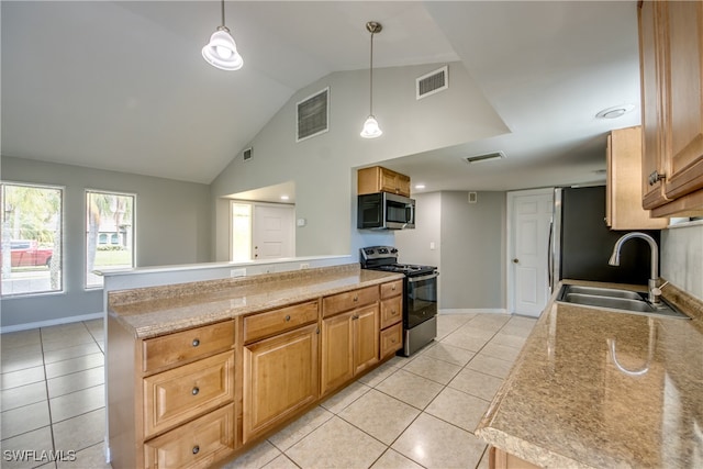 kitchen with pendant lighting, sink, light tile patterned floors, lofted ceiling, and appliances with stainless steel finishes