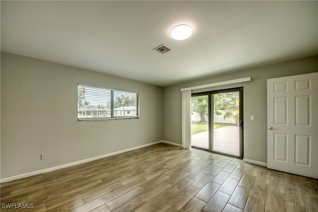 unfurnished room featuring light hardwood / wood-style flooring