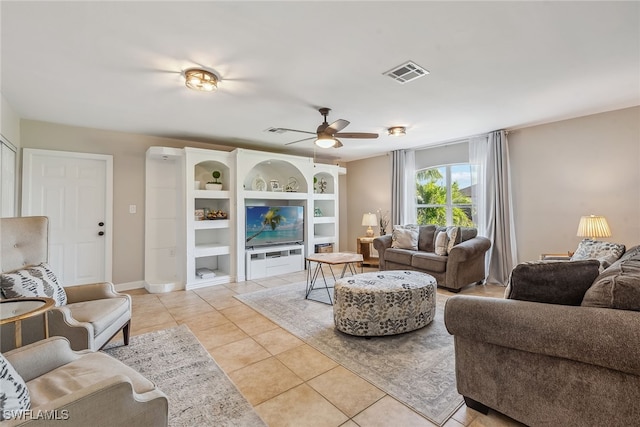 tiled living room with ceiling fan