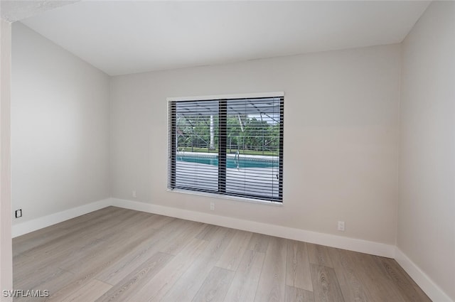 spare room with light wood-type flooring