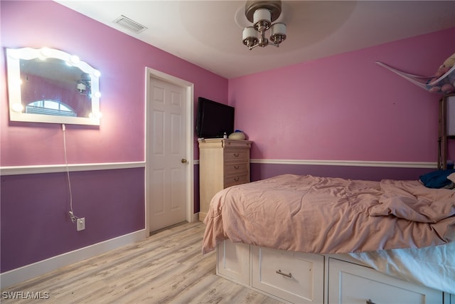 bedroom featuring ceiling fan and light hardwood / wood-style flooring