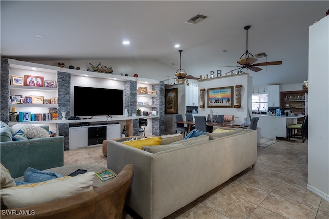 tiled living room with lofted ceiling, ceiling fan, and built in features