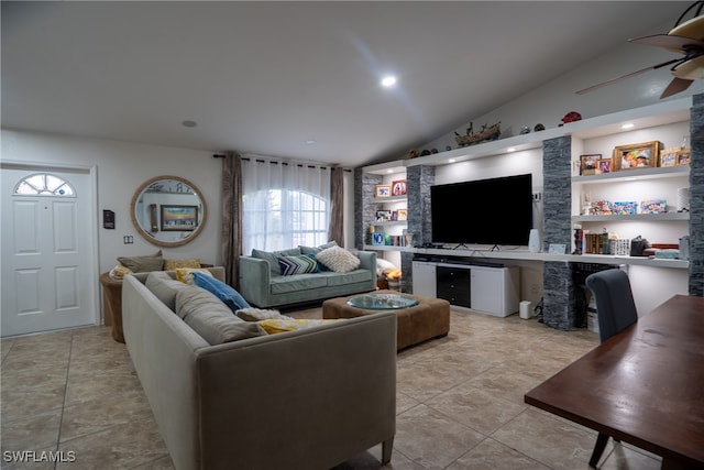 tiled living room with lofted ceiling, ceiling fan, and built in features