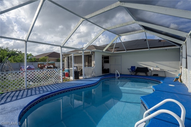 view of pool featuring a lanai and a patio area