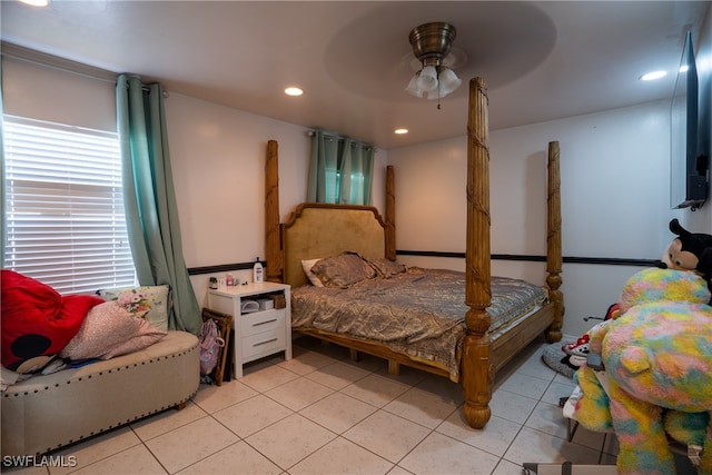 tiled bedroom with ceiling fan