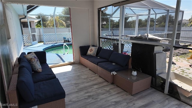 sunroom with an outdoor living space