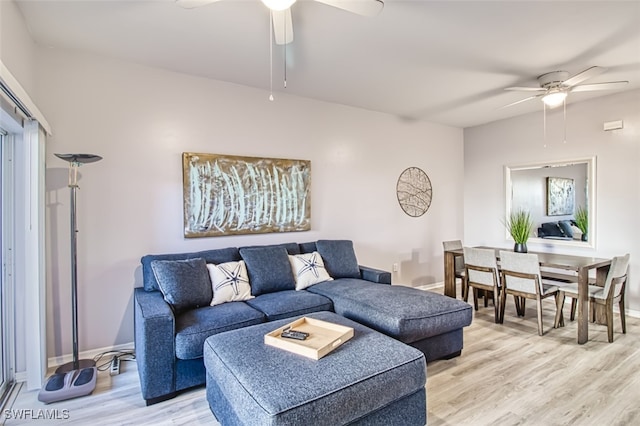 living room with hardwood / wood-style flooring and ceiling fan