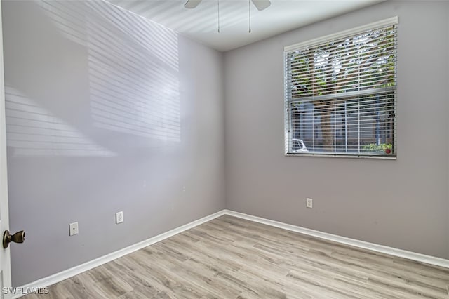 spare room with ceiling fan and light hardwood / wood-style flooring