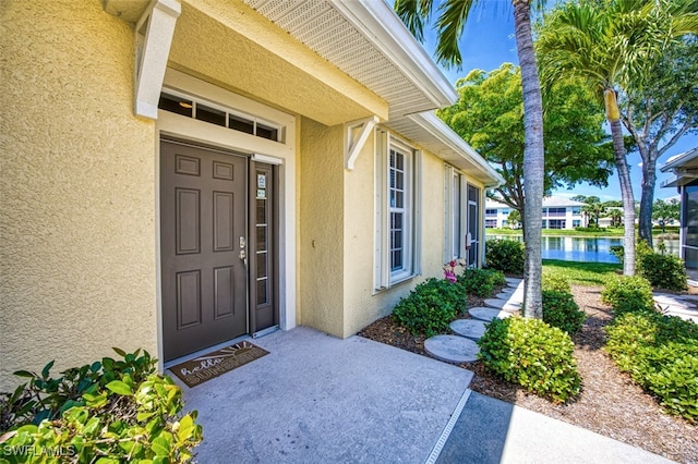 entrance to property featuring a water view