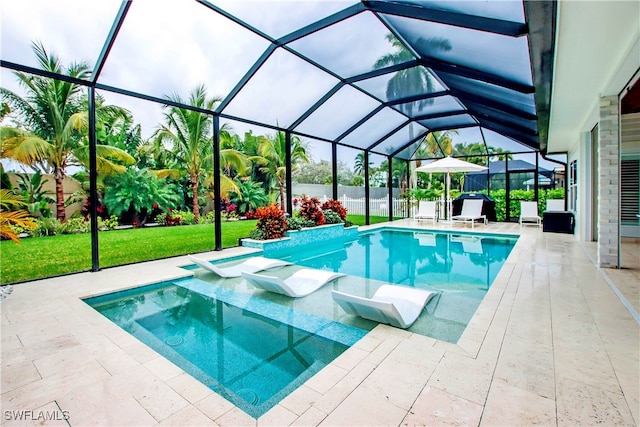 view of swimming pool featuring an in ground hot tub, a lanai, and a patio area