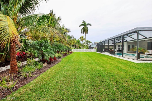 view of yard with a lanai