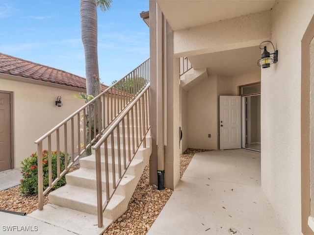 doorway to property with a patio