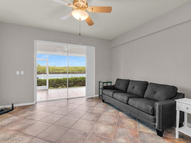 living room featuring light tile patterned flooring and ceiling fan