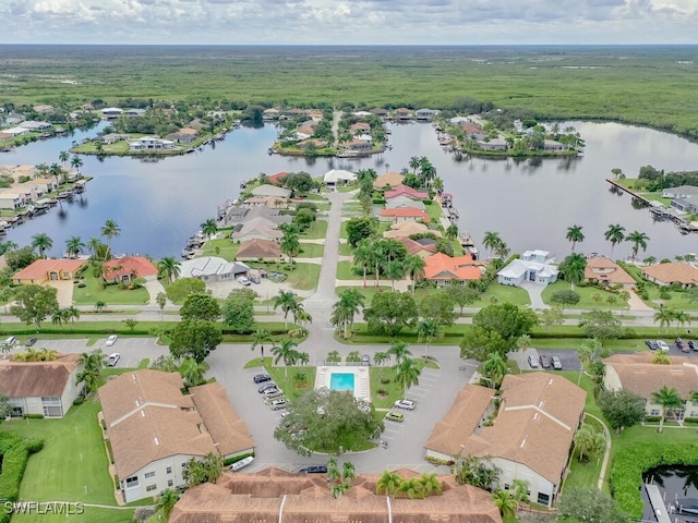 birds eye view of property with a water view