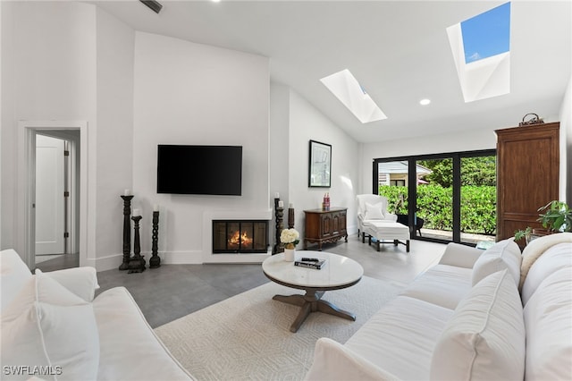 living room with concrete floors and high vaulted ceiling