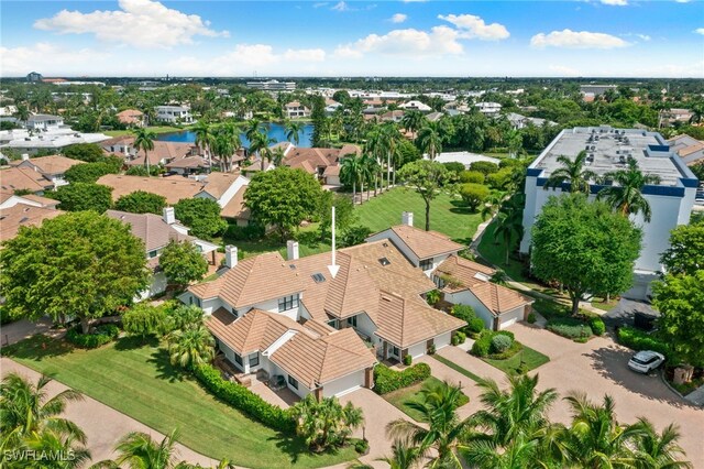 birds eye view of property featuring a water view and a residential view