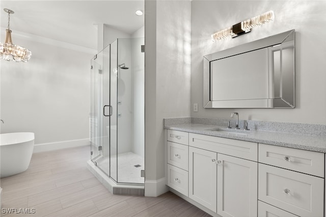 bathroom with vanity and independent shower and bath