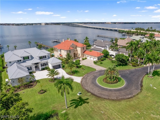 birds eye view of property with a water view